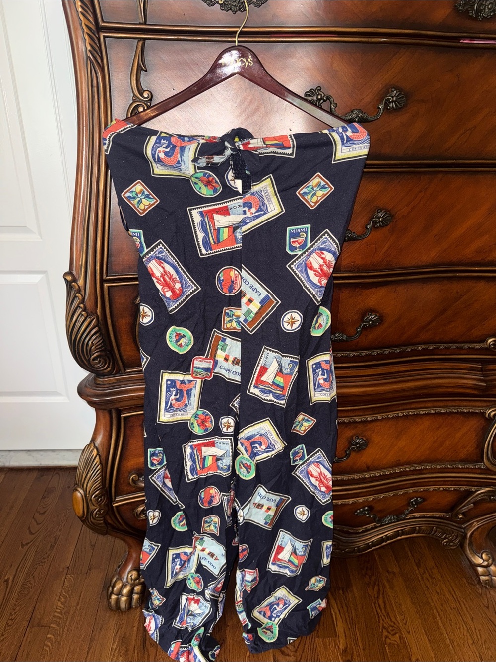 Anthropologie Navy Jumpsuit with Multicolor Nautical Stamp Print